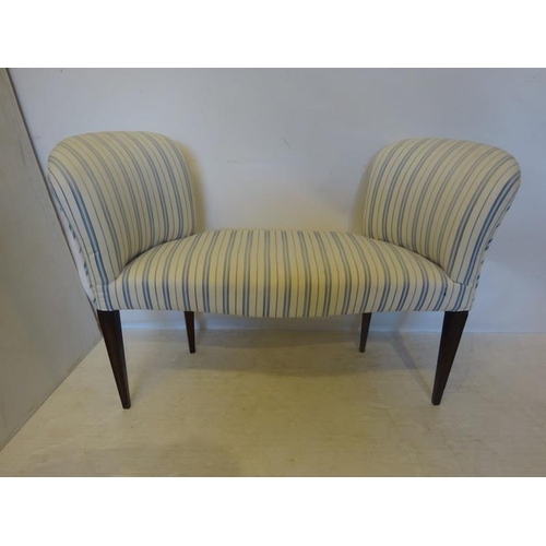 77 - Upholstered window seat raised on tapered legs. W. 117cm, H. 80cm, D. 40cm approx.