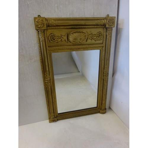 79 - A 19th century gilt framed pier mirror with shell decoration. H. 110cm, W. 70cm approx.