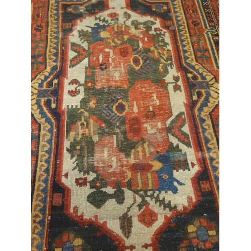 87 - Old Persian rug.  230cm x 128cm approx.