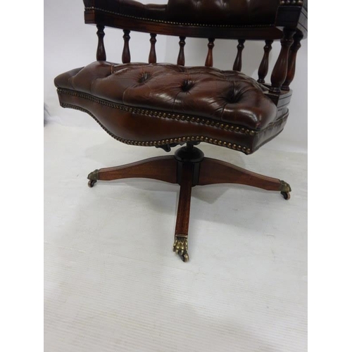 88 - A good leather upholstered and mahogany captains or office swivel chair.