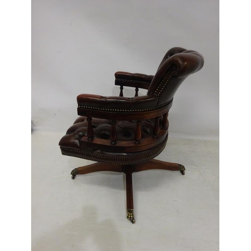 88 - A good leather upholstered and mahogany captains or office swivel chair.