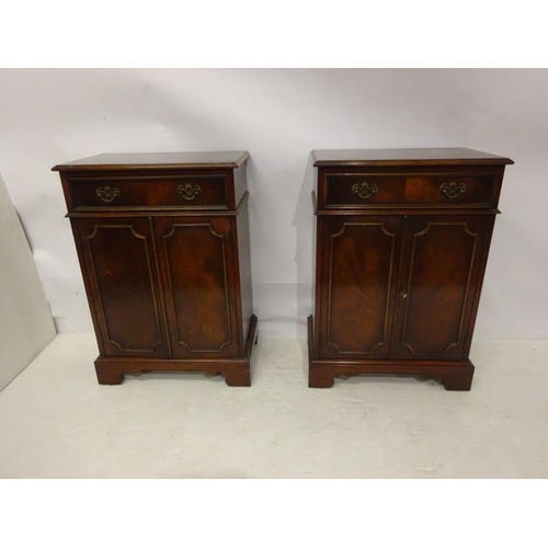 90 - A pair of good quality neat sized mahogany side cabinets each fitted with a drawer over cupboard doo... 