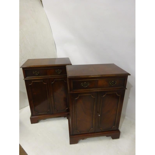 90 - A pair of good quality neat sized mahogany side cabinets each fitted with a drawer over cupboard doo... 