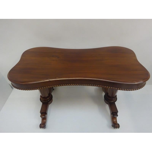 93 - Victorian mahogany centre table, the shaped top having beaded decoration and raised on column suppor... 