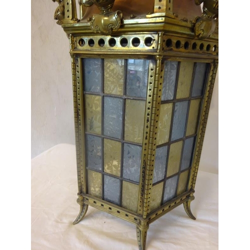 98 - Antique brass and copper hall lantern with colour glass panels. Overall height 120cm approx.