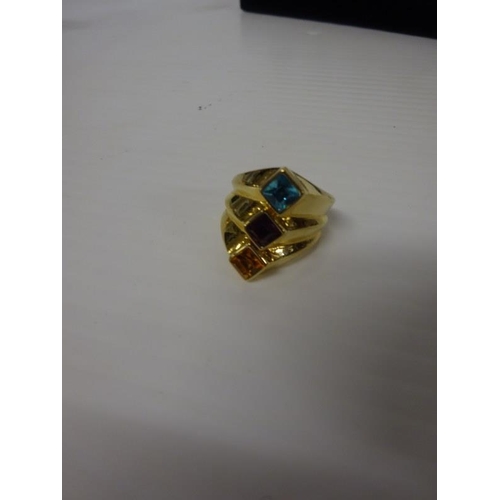 287 - 18 carat gold dress ring with coloured stones. Size R.