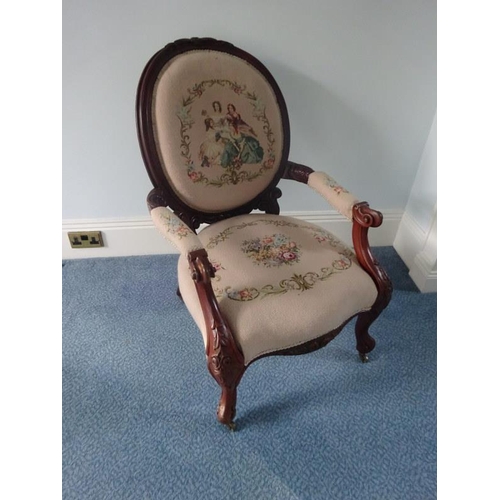 338 - A Victorian open arm drawing room chair with needlework upholstery.