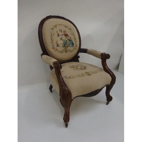 338 - A Victorian open arm drawing room chair with needlework upholstery.