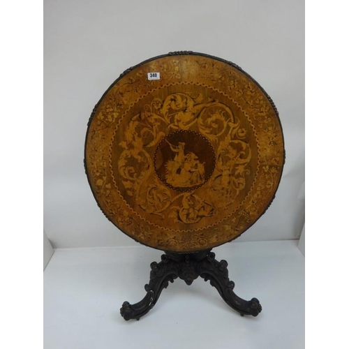 340 - A good 19th century Irish circular table, the walnut top extensively inlaid having carved freize and... 