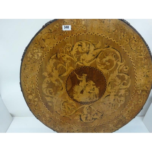 340 - A good 19th century Irish circular table, the walnut top extensively inlaid having carved freize and... 