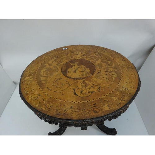 340 - A good 19th century Irish circular table, the walnut top extensively inlaid having carved freize and... 