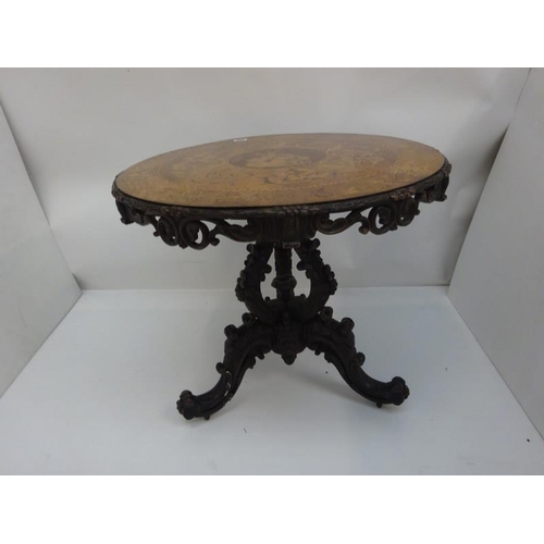 340 - A good 19th century Irish circular table, the walnut top extensively inlaid having carved freize and... 