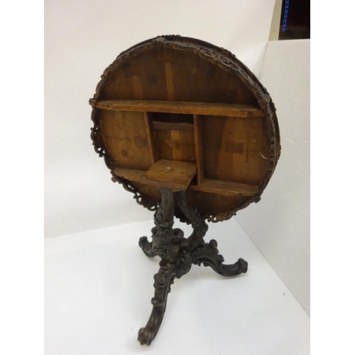 340 - A good 19th century Irish circular table, the walnut top extensively inlaid having carved freize and... 