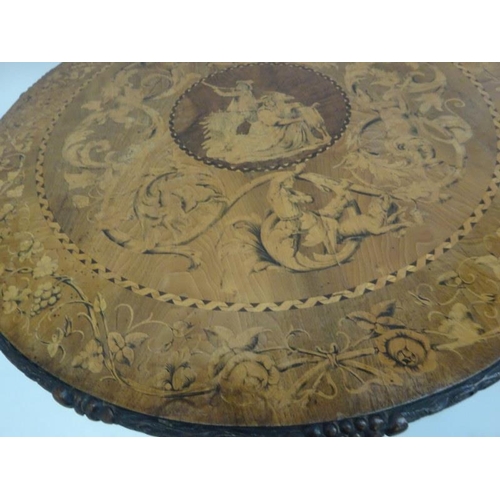 340 - A good 19th century Irish circular table, the walnut top extensively inlaid having carved freize and... 