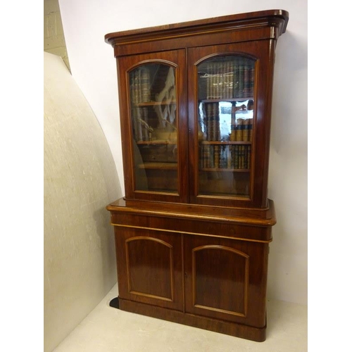 351 - Victorian mahogany two door bookcase, the upper section with glazed doors, the base fitted with a lo... 