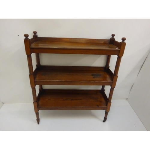 352 - A Victorian pitch pine three tier dumbwaiter. W. 103cm, D. 35cm, H. 123cm approx.