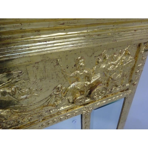 353 - Antique gilt framed over mantle mirror with chariot decoration. 124cm x 90cm.