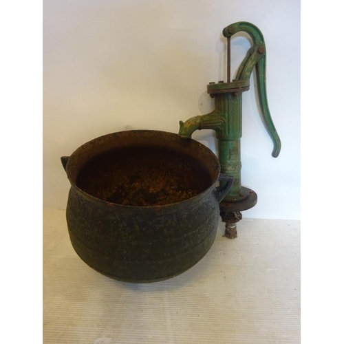 62 - Old skillet pot and cast iron pump. (2)