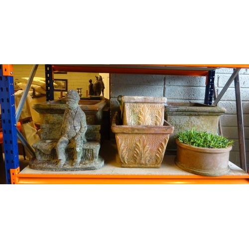 65 - Shelf of terracotta planters and one stone seated figure. (7 approx.)