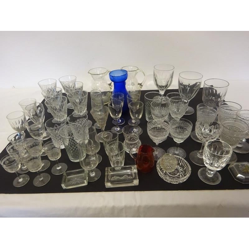 9 - Lot of drinking glasses and blue vase.