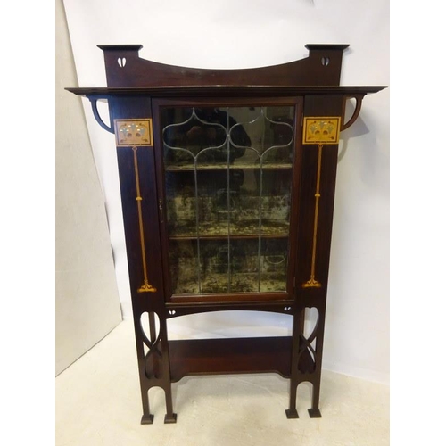 101 - A good Edwardian inlaid mahogany Arts & Crafts design drawing room cabinet having leaded glass door,... 