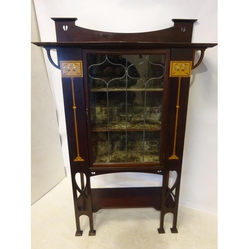 101 - A good Edwardian inlaid mahogany Arts & Crafts design drawing room cabinet having leaded glass door,... 