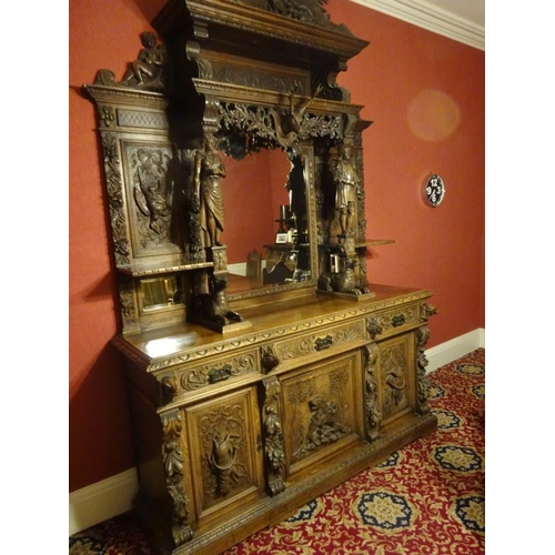 105 - A good large 19th century black forest sideboard, the upper section having carved eagle flanked by f... 