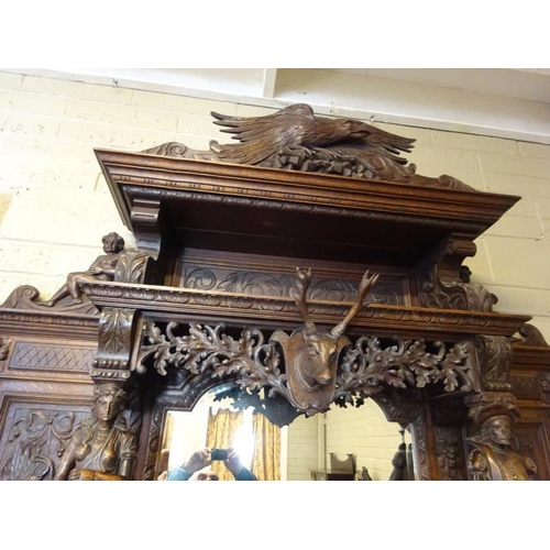 105 - A good large 19th century black forest sideboard, the upper section having carved eagle flanked by f... 