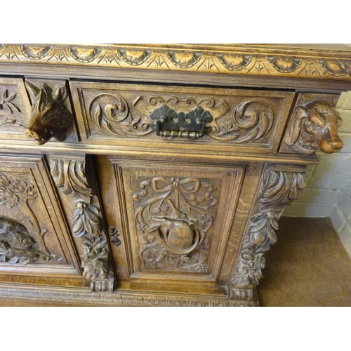 105 - A good large 19th century black forest sideboard, the upper section having carved eagle flanked by f... 