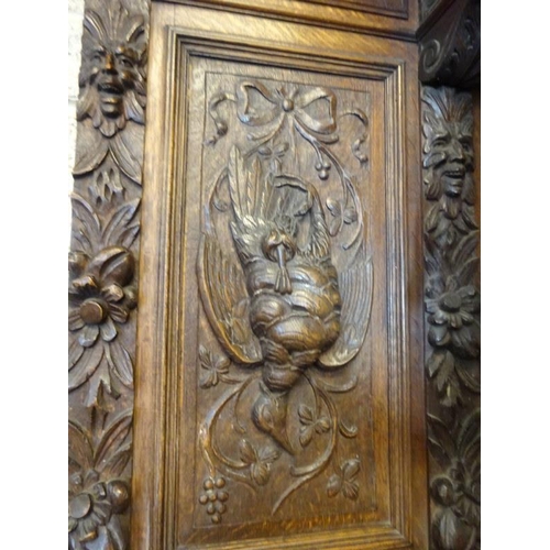 105 - A good large 19th century black forest sideboard, the upper section having carved eagle flanked by f... 