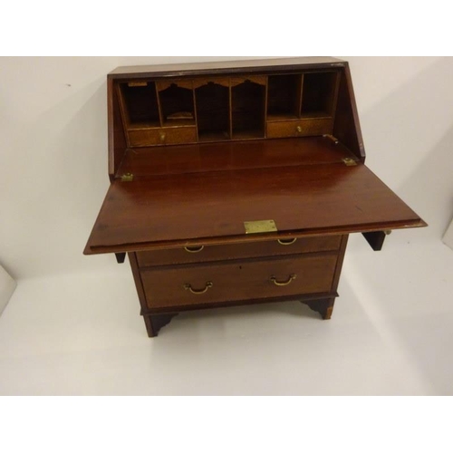 124 - Edwardian inlaid mahogany writing bureau. W. 76cm approx.(some restoration required)