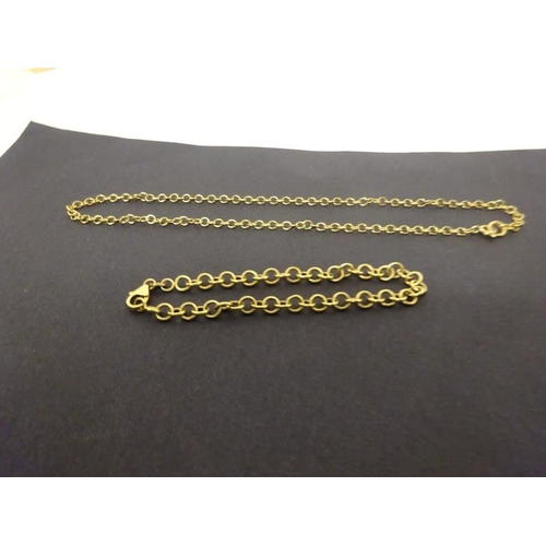 153 - Two small gold chains and a bangle. Weight 10.92g.