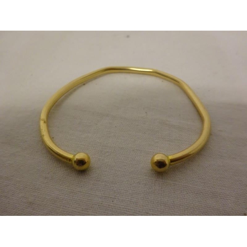 153 - Two small gold chains and a bangle. Weight 10.92g.