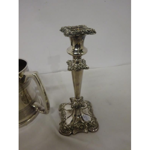 158 - A pair of Sheffield plated candlesticks and a three handled tankard.