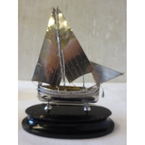 177 - Maltese silver sailing boat and oar mounted on timber plaque.