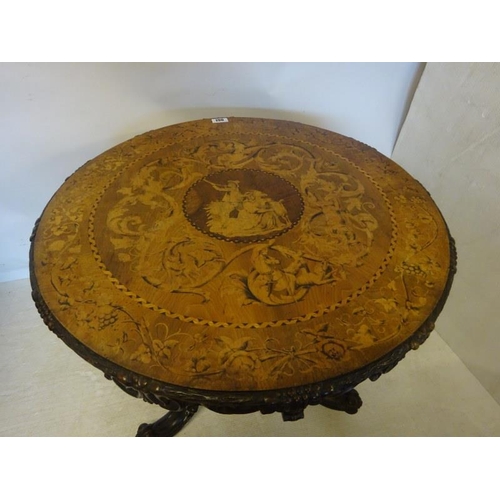 190 - A good 19th century Irish circular table, the walnut top extensively inlaid having carved freize and... 