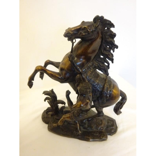 192 - A good pair of antique bronze Marley horses and horsemen. H. 38cm approx.