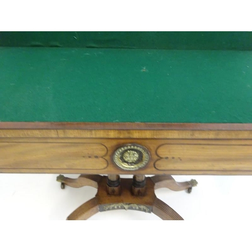 193 - Georgian mahogany and brass mounted fold over card table raised on twin column supports and reeded s... 