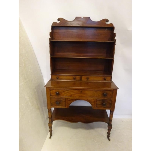 222 - A good antique mahogany desk top bookshelves fitted with five drawers and raised on ring turned legs... 