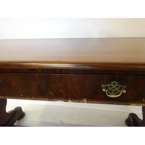 245 - Victorian mahogany side table fitted with a drawer and raised on shaped side columns.  W. 108cm, D. ... 