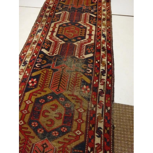 275 - Old Persian runner rug, (some parts worn). 322cm x 96cm approx.