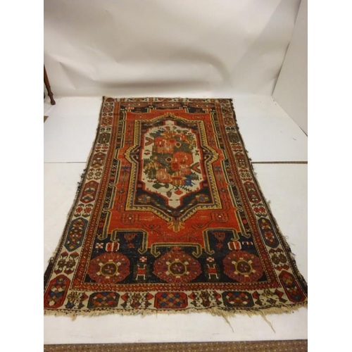 280 - Old Persian rug (centre part worn). 232cm x 127cm approx.