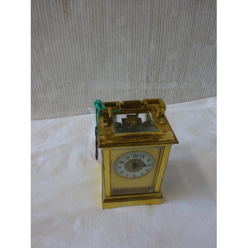 286 - Antique brass carriage clock with key in working order.