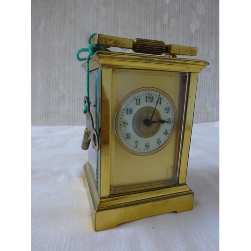 286 - Antique brass carriage clock with key in working order.