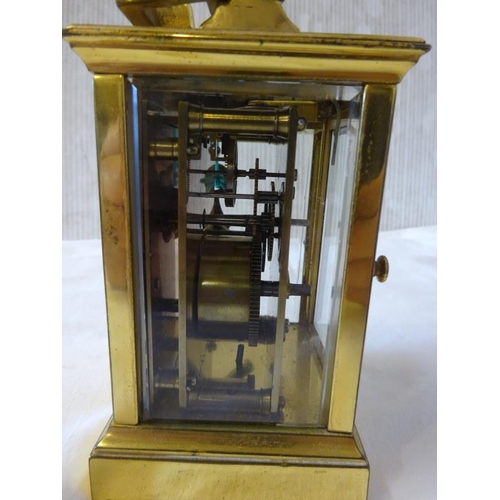 286 - Antique brass carriage clock with key in working order.