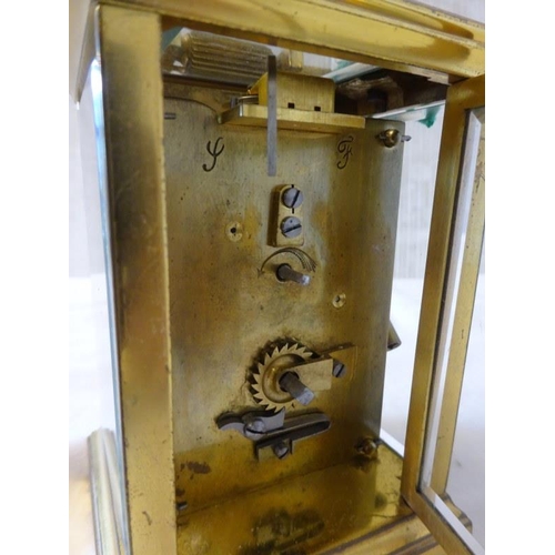 286 - Antique brass carriage clock with key in working order.