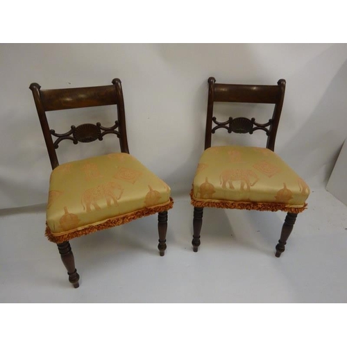 306 - A pair of antique mahogany side chairs with shell decoration.