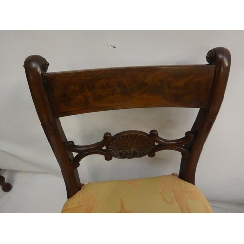 306 - A pair of antique mahogany side chairs with shell decoration.