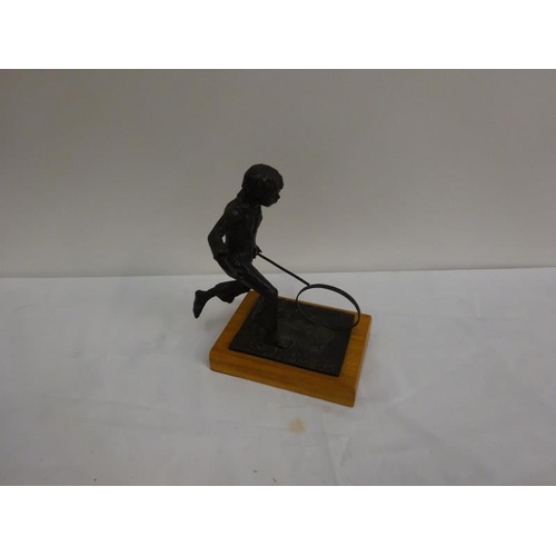 314 - Bronze figure, boy pushing hoop. Signed Sanders.