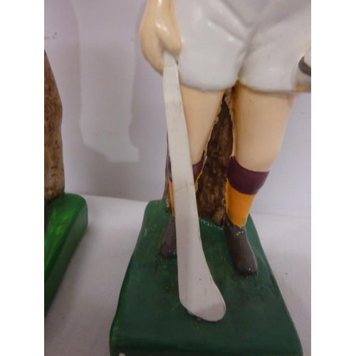 32 - A pair of figures, Cork & Wexford GAA hurlers.